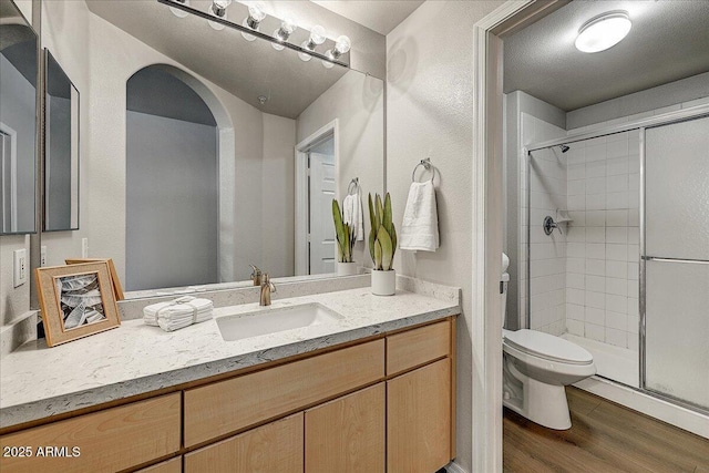 29606 N Tatum Blvd N Unit 265, Cave Creek, AZ 85331 - bathroom with wood finished floors, vanity, and a shower stall
