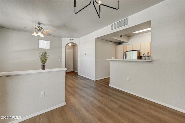 29606 N Tatum Blvd N Unit 265, Cave Creek, AZ 85331 - spare room featuring arched walkways, ceiling fan, and wood finished floors