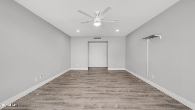 unfurnished room featuring ceiling fan, recessed lighting, baseboards, wood finished floors, and visible vents