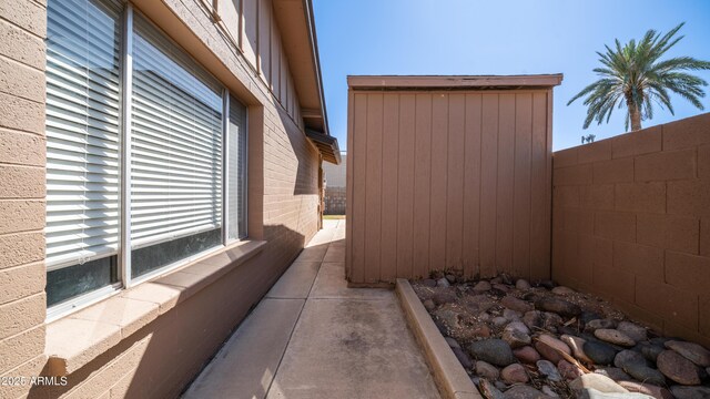 view of home's exterior with fence