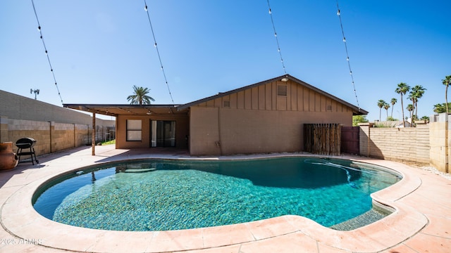 view of pool featuring a fenced in pool, a fenced backyard, and a patio area