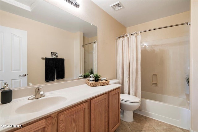 full bathroom with tile patterned flooring, vanity, shower / tub combo, and toilet