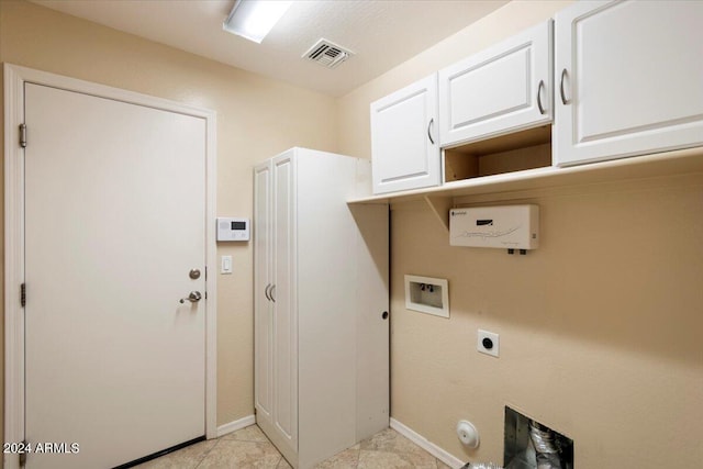 laundry room featuring cabinets, hookup for a washing machine, electric dryer hookup, hookup for a gas dryer, and light tile patterned flooring