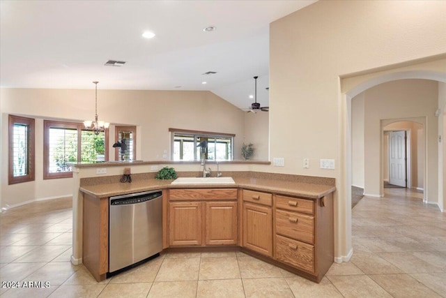 kitchen with light tile patterned floors, ceiling fan with notable chandelier, stainless steel dishwasher, and sink