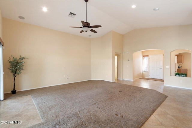 interior space featuring high vaulted ceiling and ceiling fan