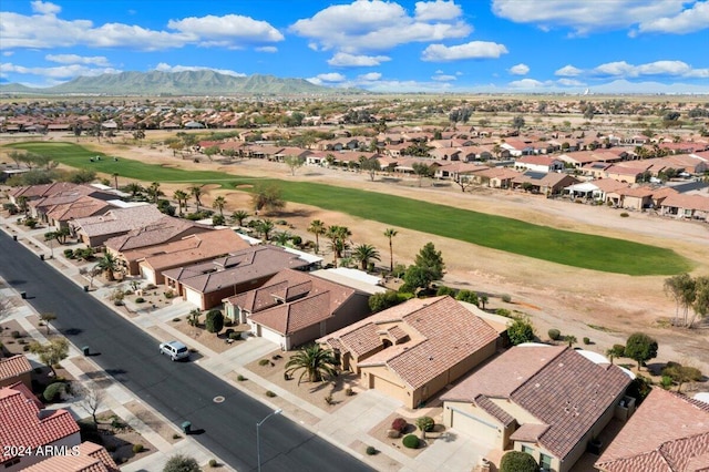 birds eye view of property with a mountain view