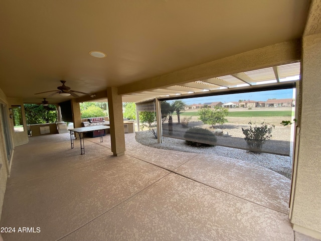 view of patio featuring ceiling fan