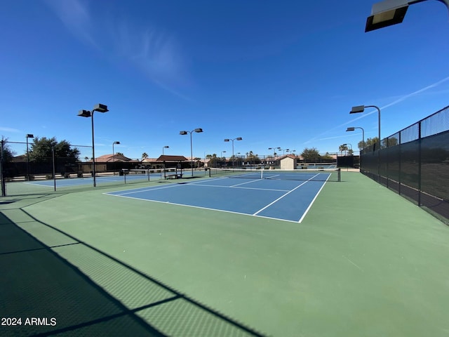 view of sport court with basketball hoop