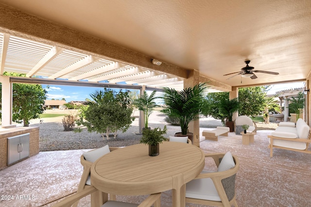 view of patio with ceiling fan and a pergola