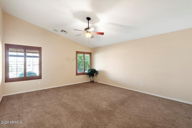 empty room featuring carpet floors, ceiling fan, and lofted ceiling