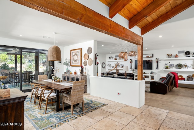 dining room with wood ceiling and vaulted ceiling with beams