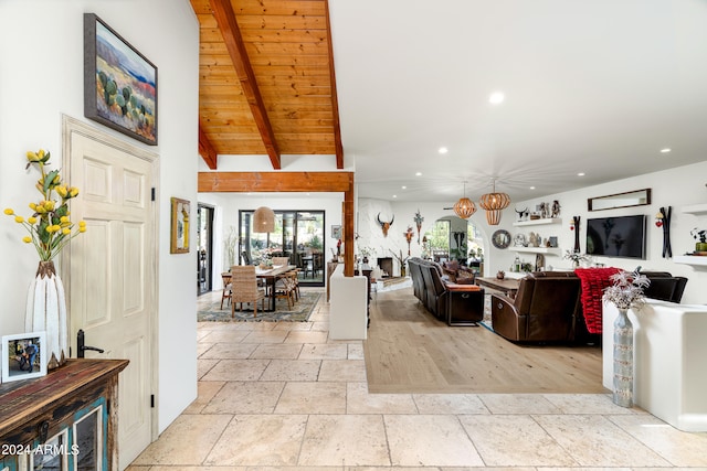 living room featuring wooden ceiling and vaulted ceiling with beams