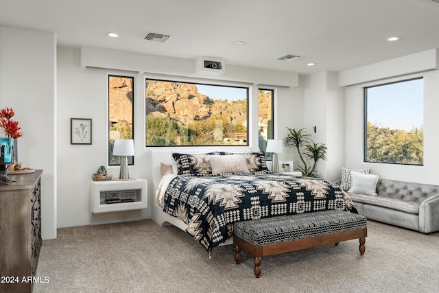 bedroom featuring light carpet