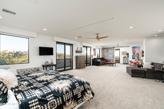 carpeted bedroom featuring ceiling fan and access to exterior