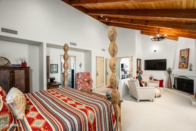 carpeted bedroom with vaulted ceiling with beams and wooden ceiling