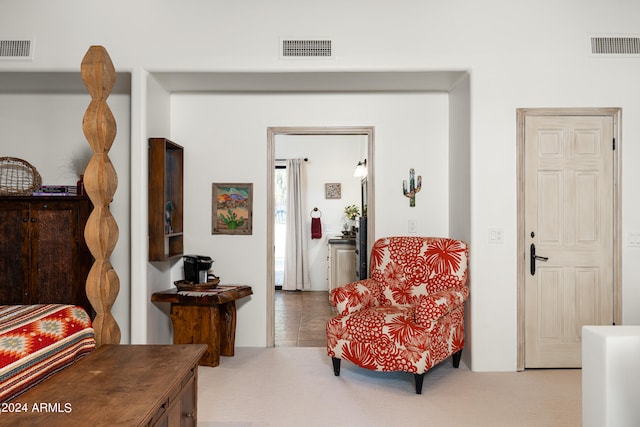 sitting room with carpet floors