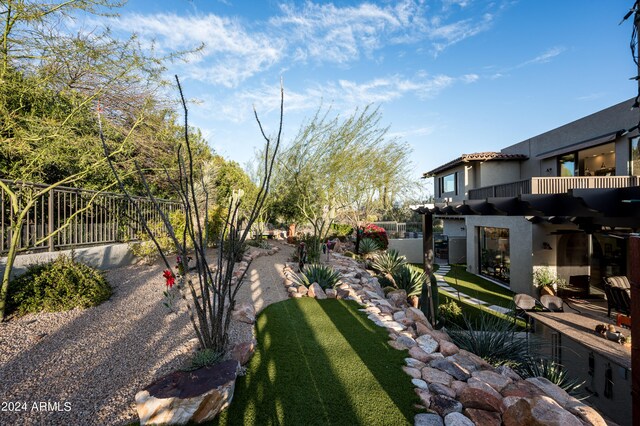 view of yard featuring a balcony