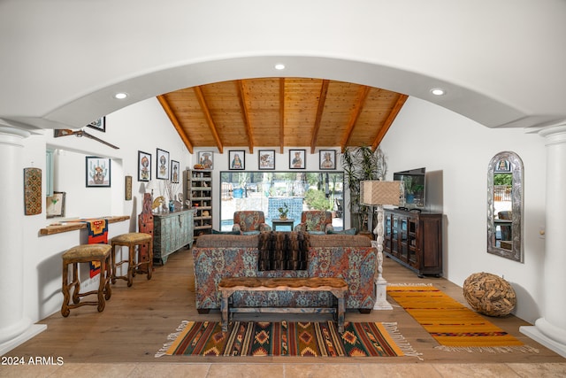 living room with wooden ceiling, wood-type flooring, ornate columns, and vaulted ceiling with beams