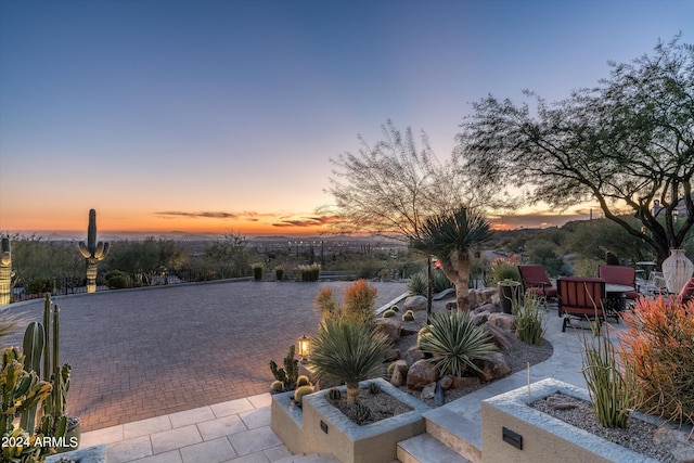 view of patio terrace at dusk