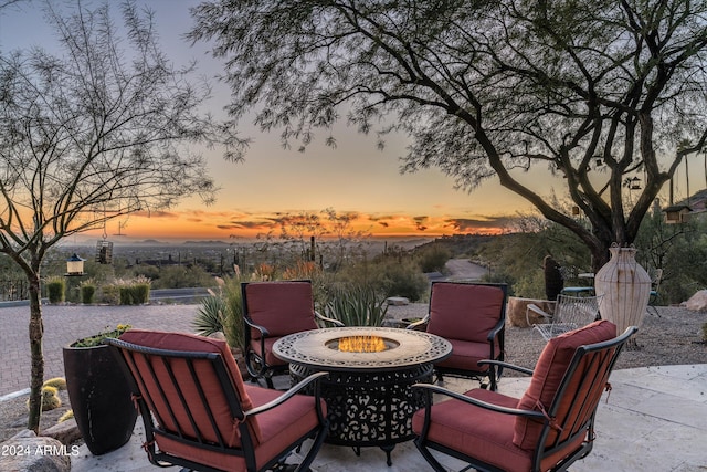 patio terrace at dusk with a fire pit