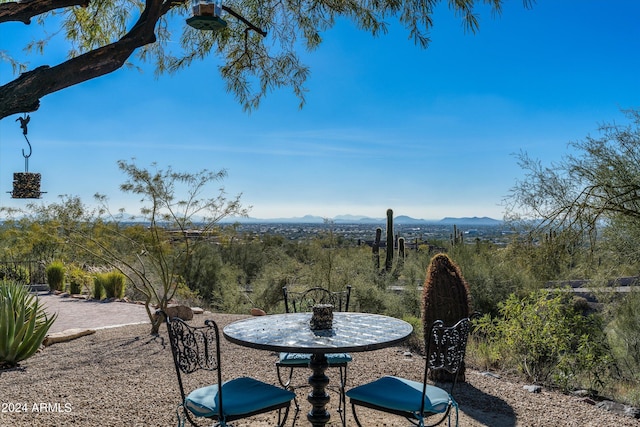 view of patio / terrace featuring a mountain view