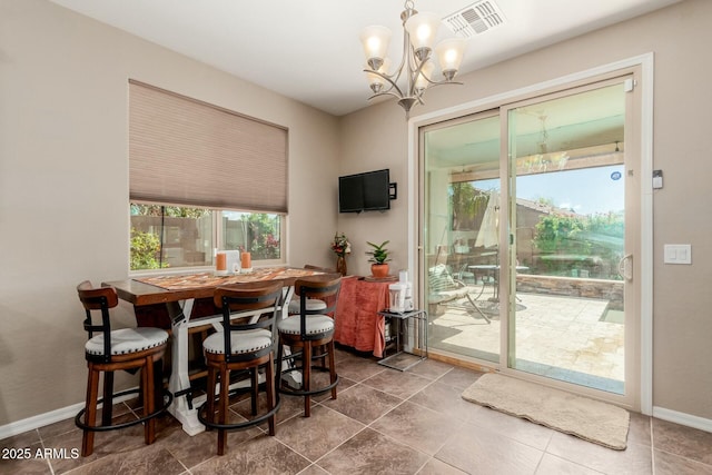 dining area with visible vents, baseboards, and a chandelier