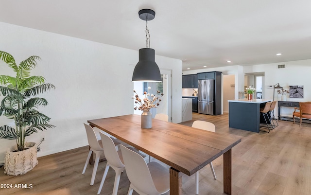 dining room with light hardwood / wood-style flooring