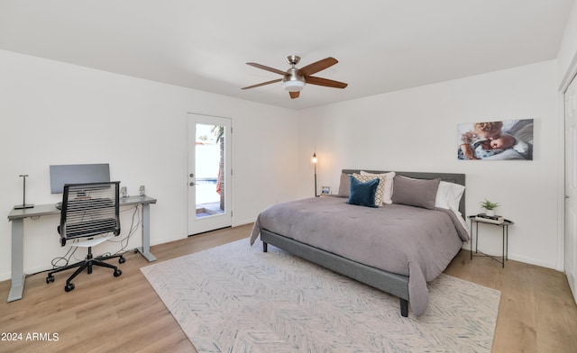 bedroom with access to outside, ceiling fan, and light wood-type flooring