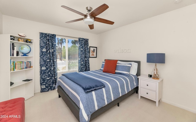 bedroom with ceiling fan and light colored carpet