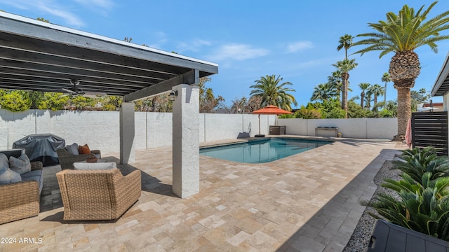 view of pool featuring a patio area and ceiling fan