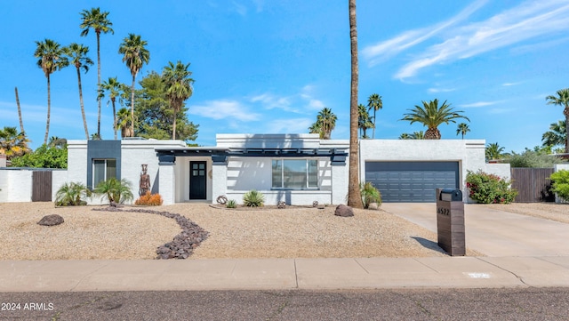 view of front of home featuring solar panels and a garage