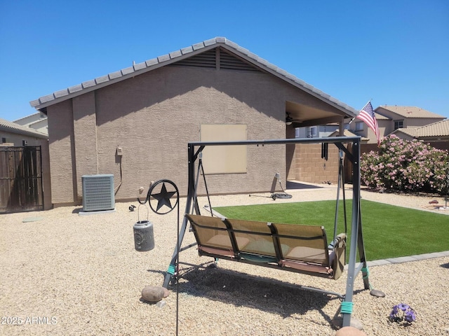 1769 E Jacob St, San Tan Valley, AZ 85140 - back of house featuring cooling unit and stucco siding