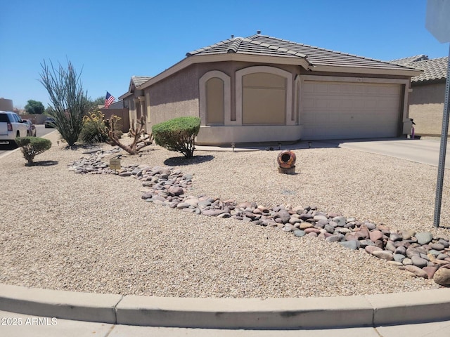 1769 E Jacob St, San Tan Valley, AZ 85140 - view of front of property featuring an attached garage, stucco siding, concrete driveway, and a tiled roof