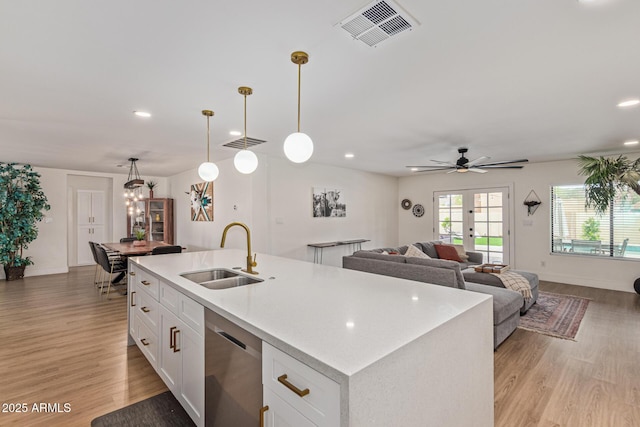 2033 E Janice Way, Phoenix, AZ 85022 - kitchen featuring a sink, dishwasher, light countertops, light wood-style flooring, and white cabinetry