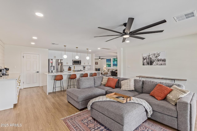 2033 E Janice Way, Phoenix, AZ 85022 - living area featuring ceiling fan, light wood-style floors, and recessed lighting