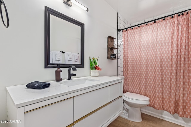 2033 E Janice Way, Phoenix, AZ 85022 - bathroom with wood finished floors, vanity, and toilet