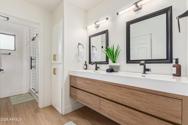 2033 E Janice Way, Phoenix, AZ 85022 - full bathroom with wood finished floors, double vanity, a stall shower, and baseboards