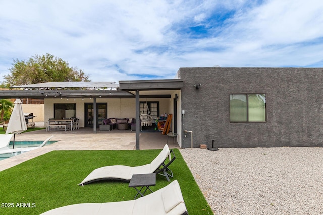 2033 E Janice Way, Phoenix, AZ 85022 - rear view of property with an outdoor hangout area, solar panels, stucco siding, and a patio