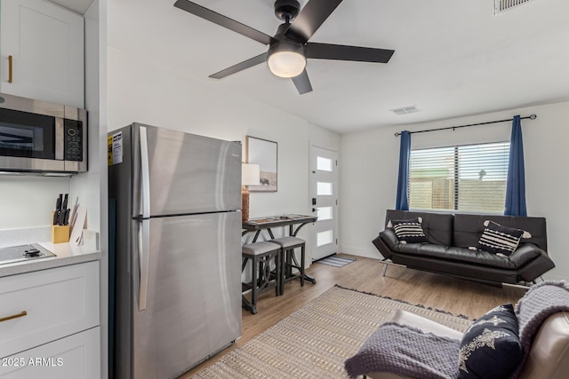 2033 E Janice Way, Phoenix, AZ 85022 - living room featuring ceiling fan and light wood-type flooring