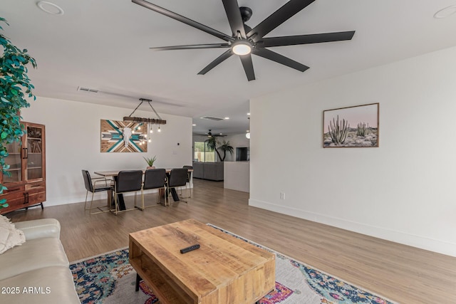 2033 E Janice Way, Phoenix, AZ 85022 - living room featuring ceiling fan, wood finished floors, and baseboards