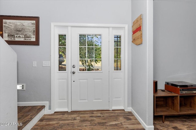 entryway with dark hardwood / wood-style floors