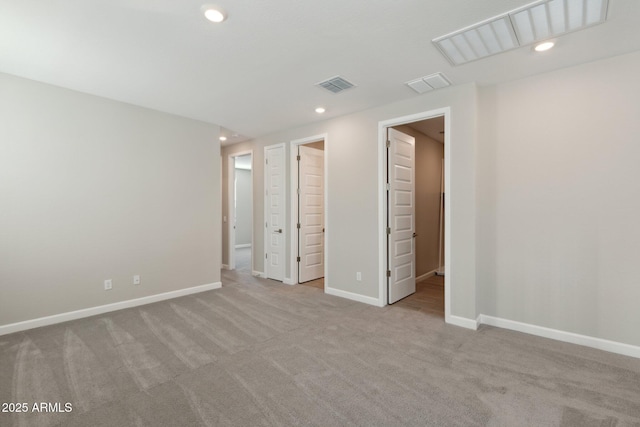 unfurnished bedroom with recessed lighting, visible vents, carpet floors, and baseboards