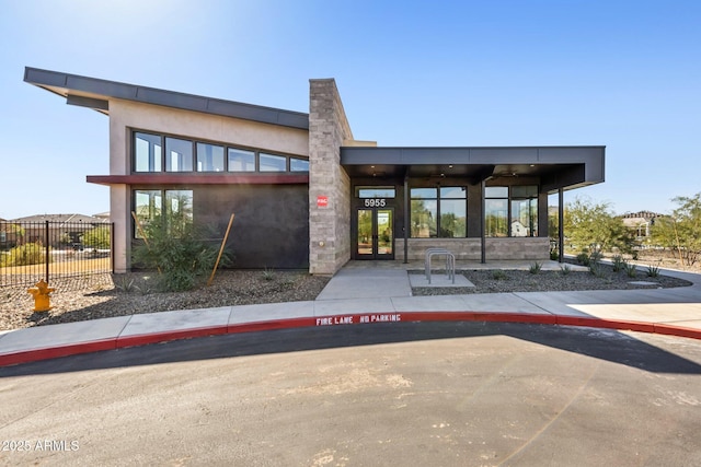 exterior space with fence and stucco siding