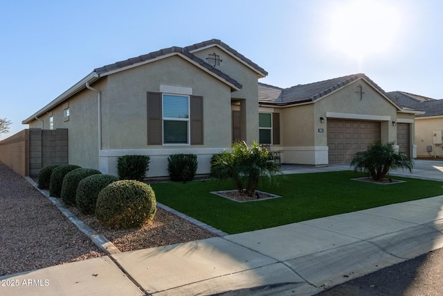 view of front of home with a garage and a front yard