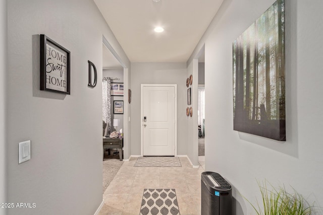 hallway with light tile patterned floors