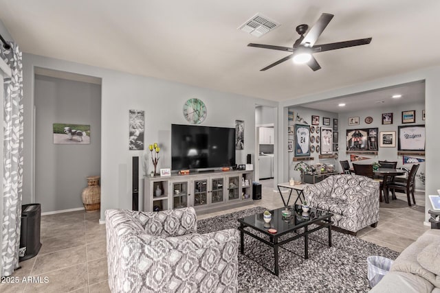 living room featuring ceiling fan and light tile patterned flooring