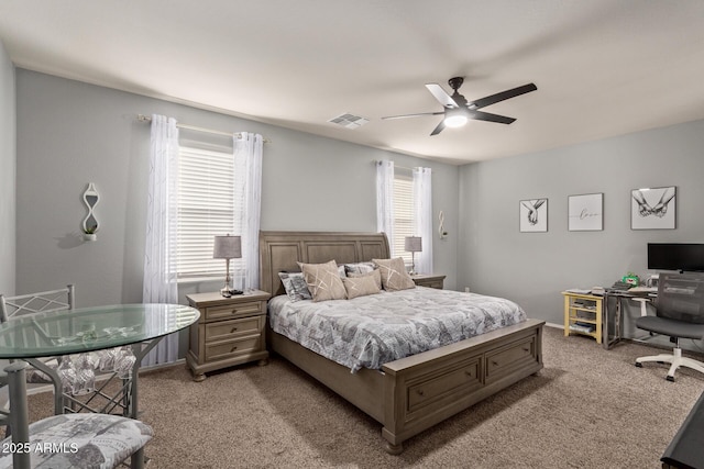 bedroom featuring ceiling fan and light carpet