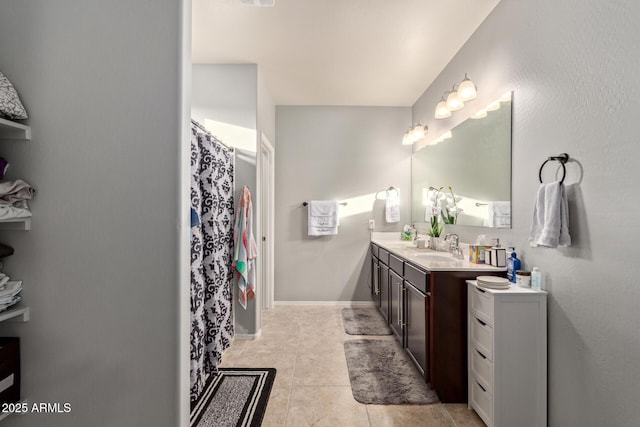 bathroom with tile patterned flooring and vanity