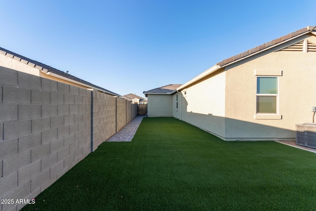 view of yard with central AC