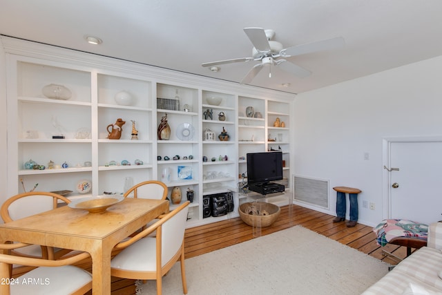 dining space with light hardwood / wood-style floors and ceiling fan